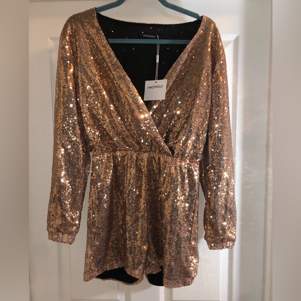 Brand new with tags Gold romper shorts jumpsuit. Size medium.